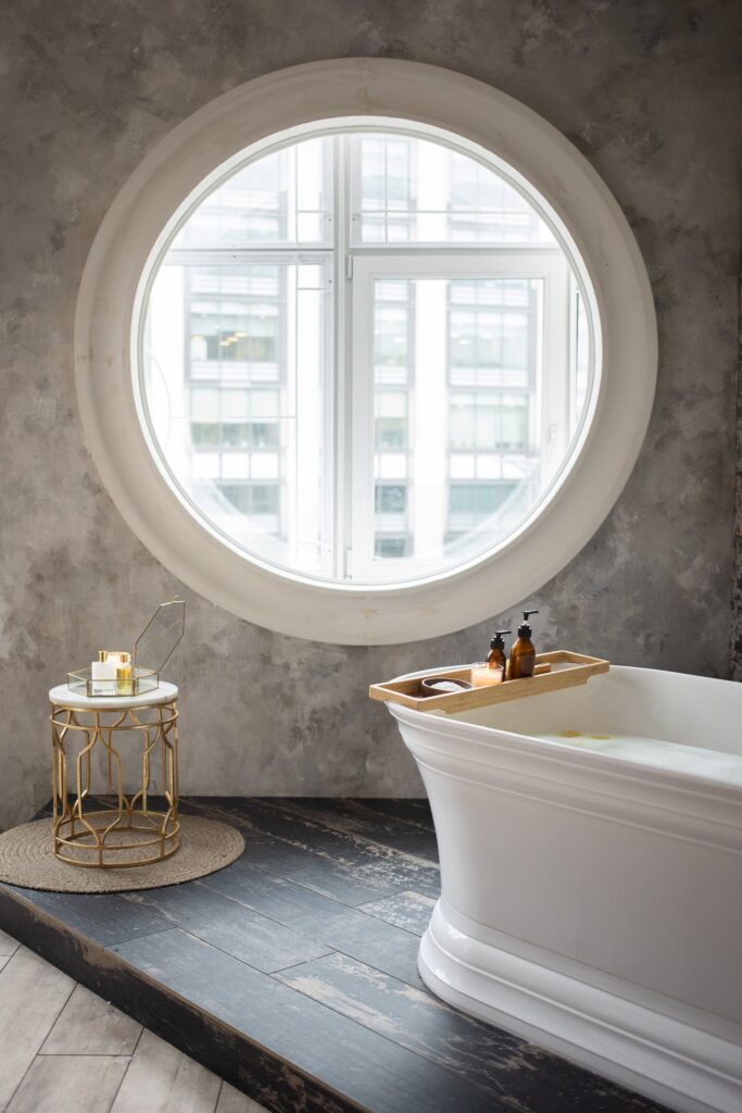 a bathroom remodeling with a round window