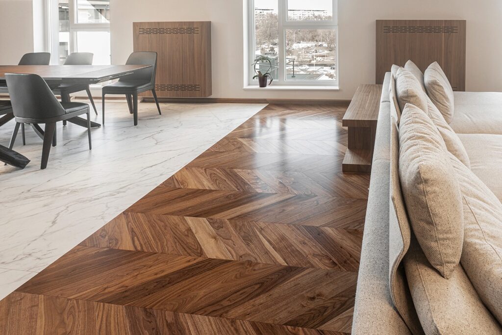 Stylish living room featuring modern hardwood flooring, creating a warm and inviting atmosphere with natural light.