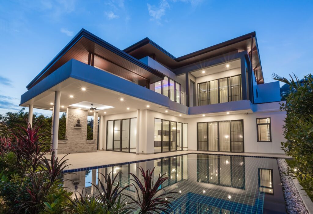 modern house with swimming pool at dusk